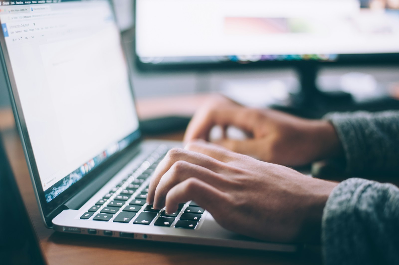 Professional focused at a computer, building a website